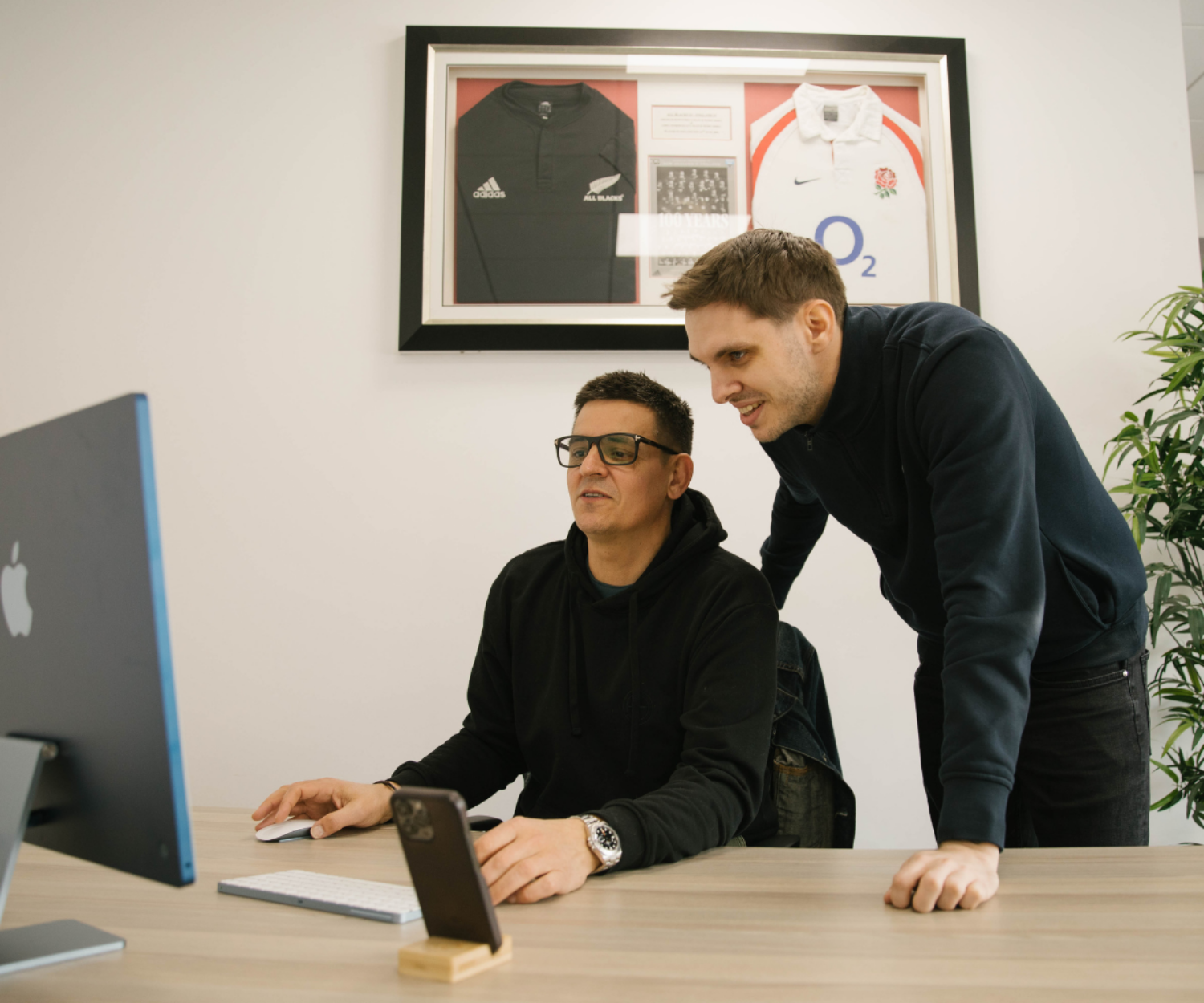 Men working on desktop