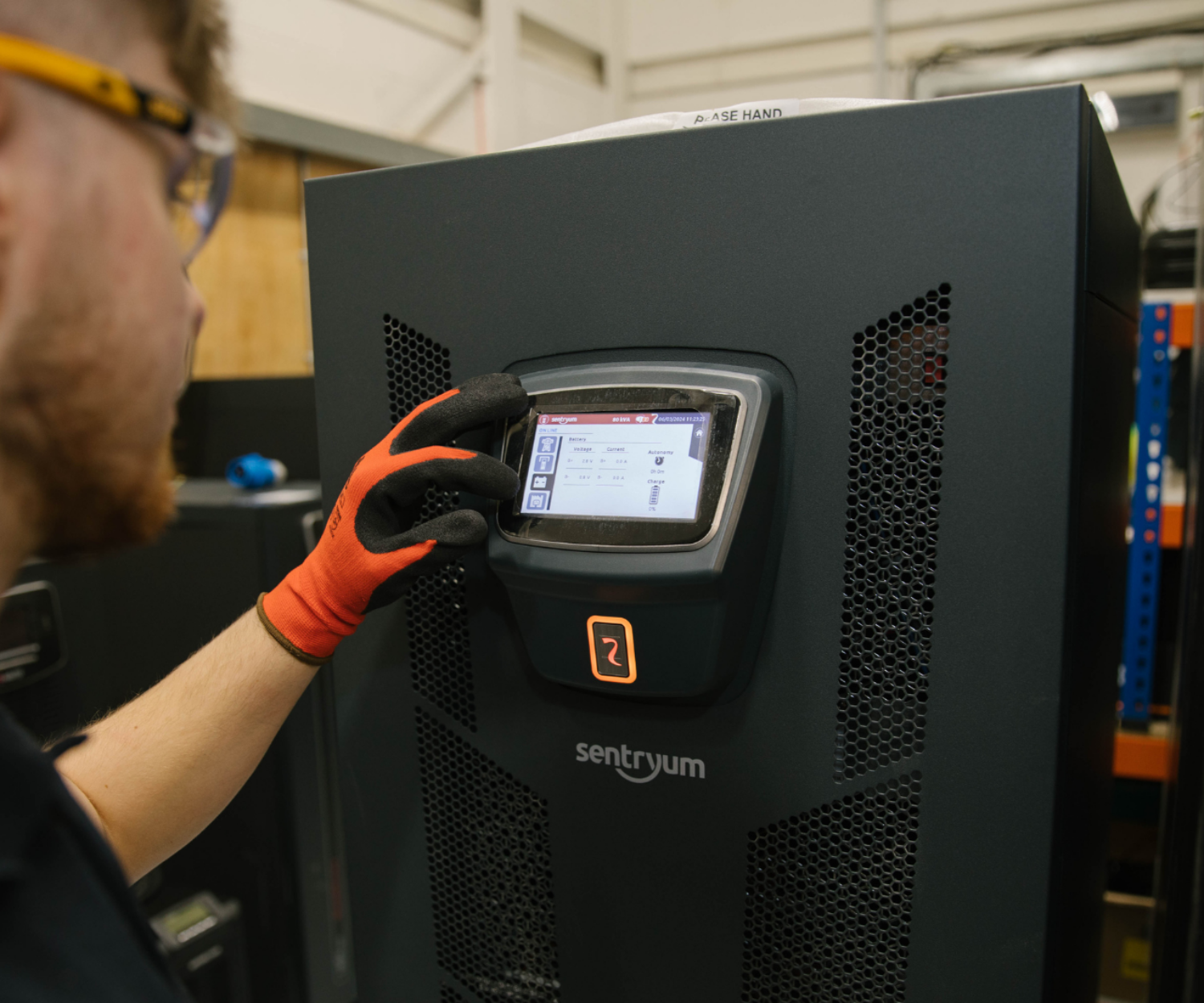 Man looks closely at battery monitoring dashboard